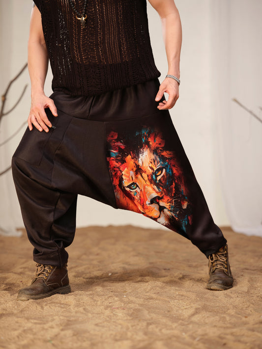 Men’s black harem pants with colorful artistic lion graphic print – relaxed streetwear pants for dance, travel and festival fashion.