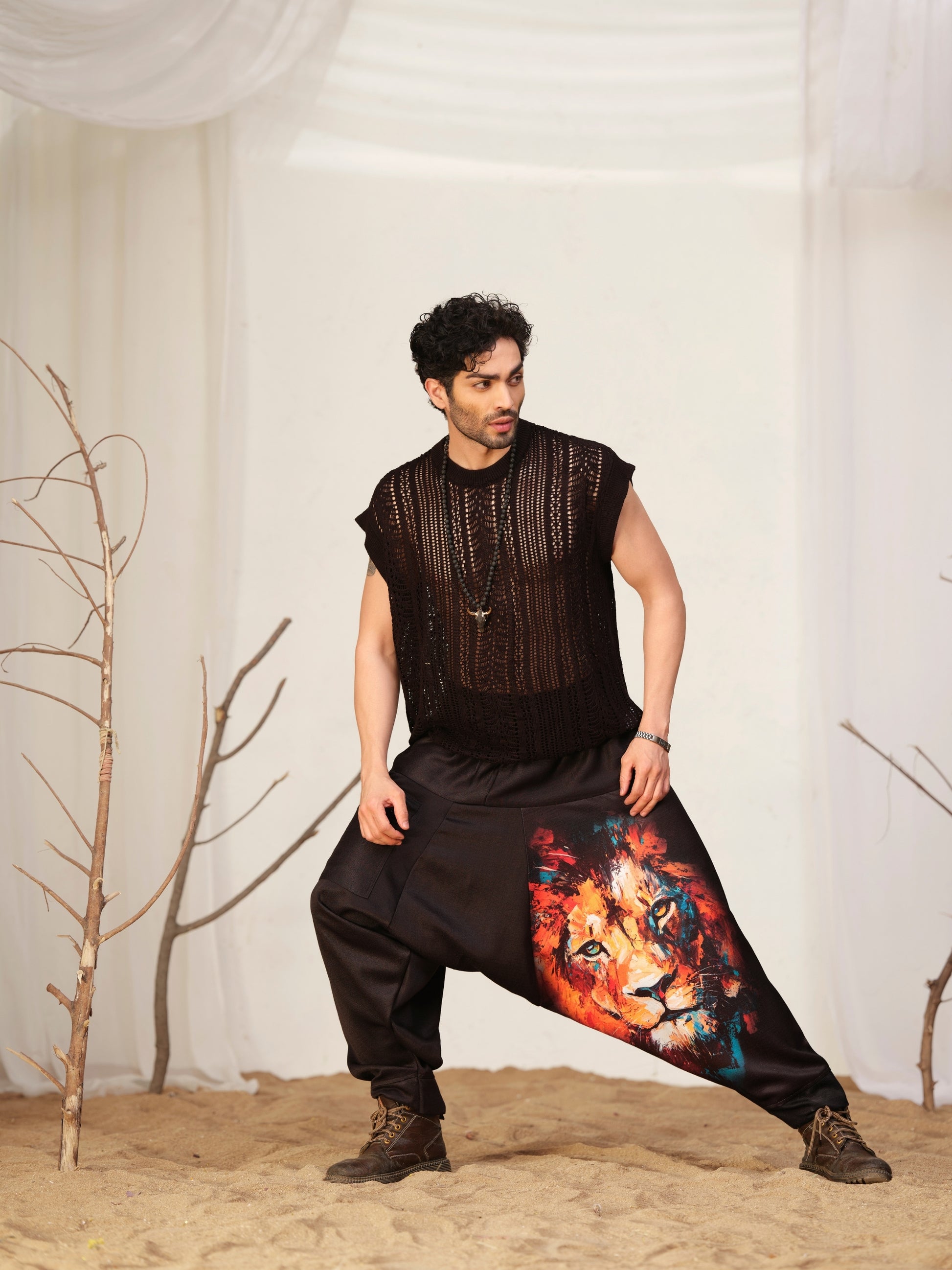 Men’s black harem pants with colorful artistic lion graphic print – relaxed streetwear pants for dance, travel and festival fashion.