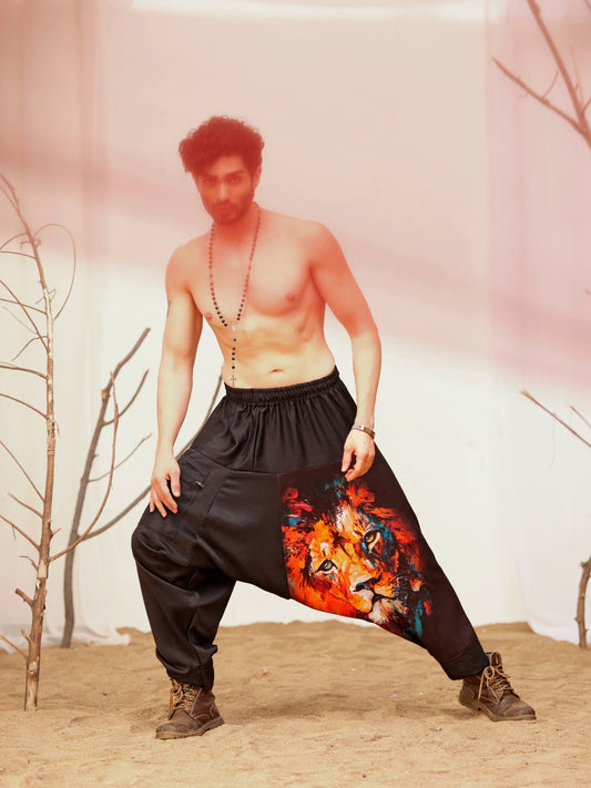 Men’s black harem pants with colorful artistic lion graphic print – relaxed streetwear pants for dance, travel and festival fashion.
