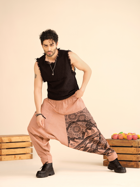 Men’s peach cotton harem pants with mandala landscape artwork and linen texture fabric for yoga travel and festival wear.