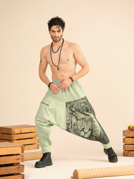 Men’s sage green cotton harem pants with lion illustration print and linen texture fabric for yoga, travel and dance wear.