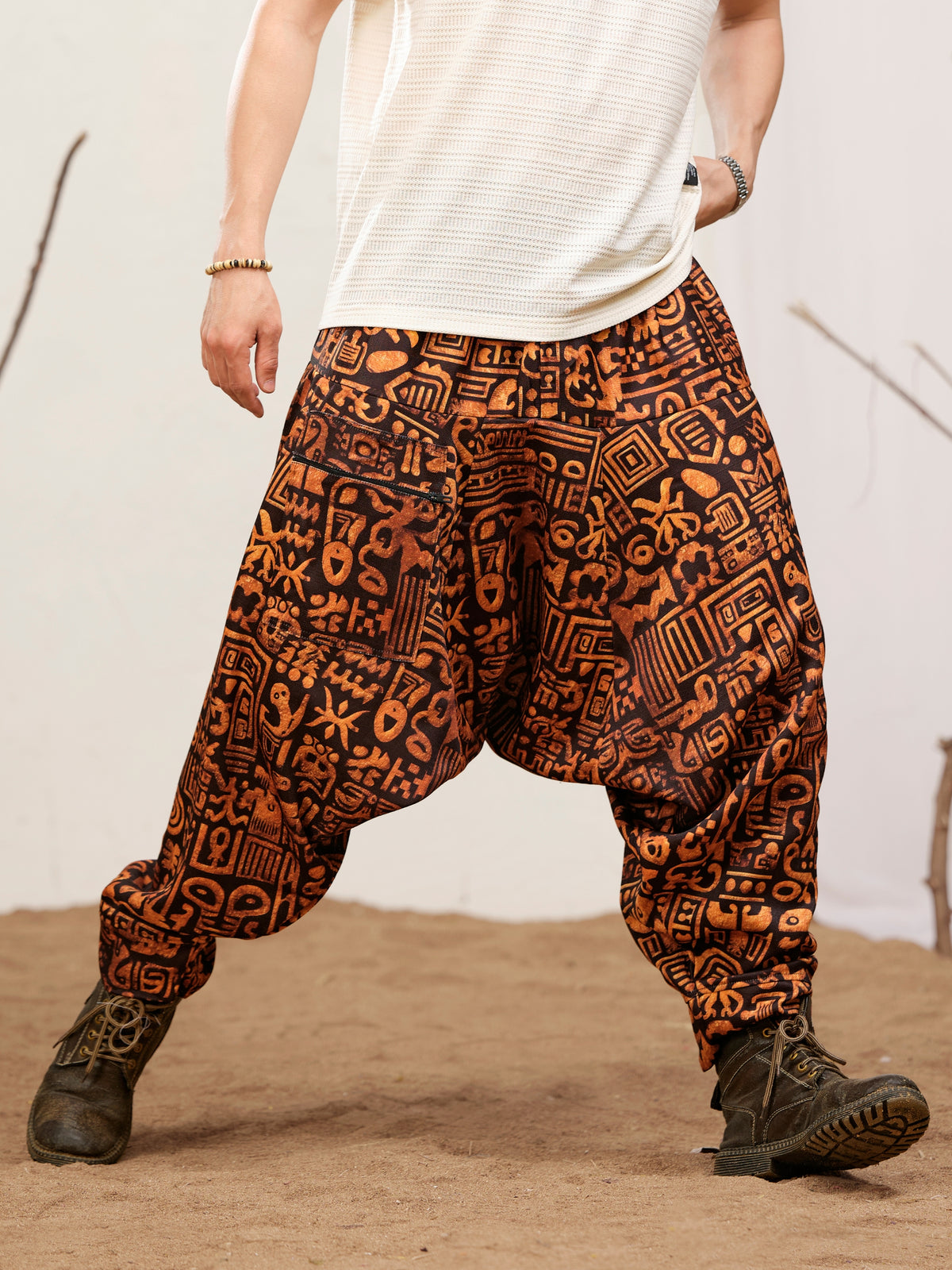 Printed harem pants for men in black and rust abstract glyph print - H138