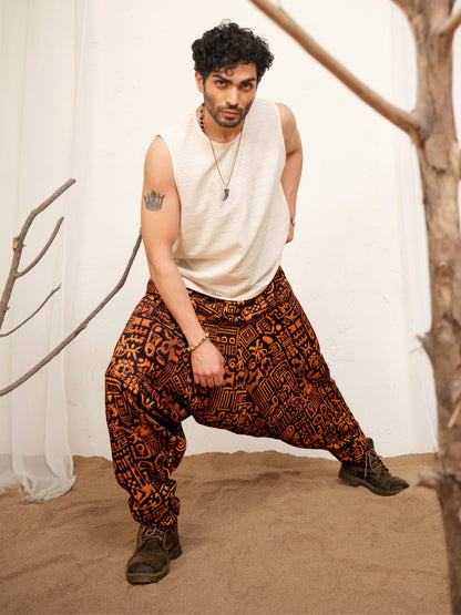 Black and rust orange baggy harem pants for men with abstract symbol print