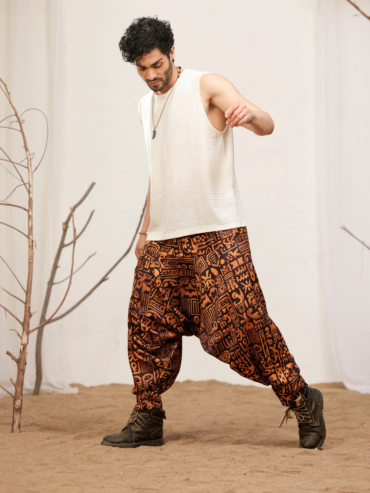 Black and rust printed harem pants for men with elastic waist and zip pocket