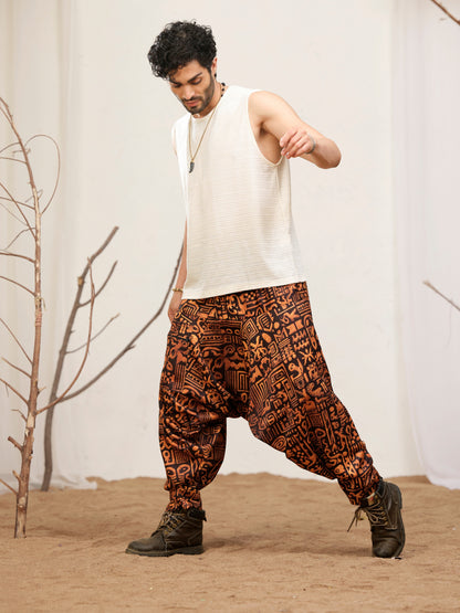 Black and rust printed harem pants for men with elastic waist and zip pocket
