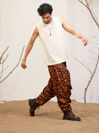 Unisex black and rust abstract print harem pants with gathered ankle cuffs