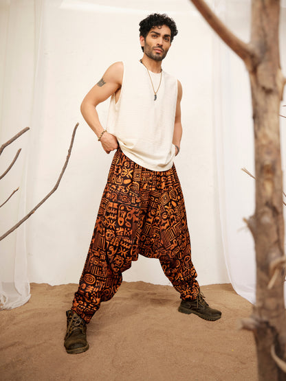 Black and rust abstract glyph print harem pants for men in a relaxed baggy fit